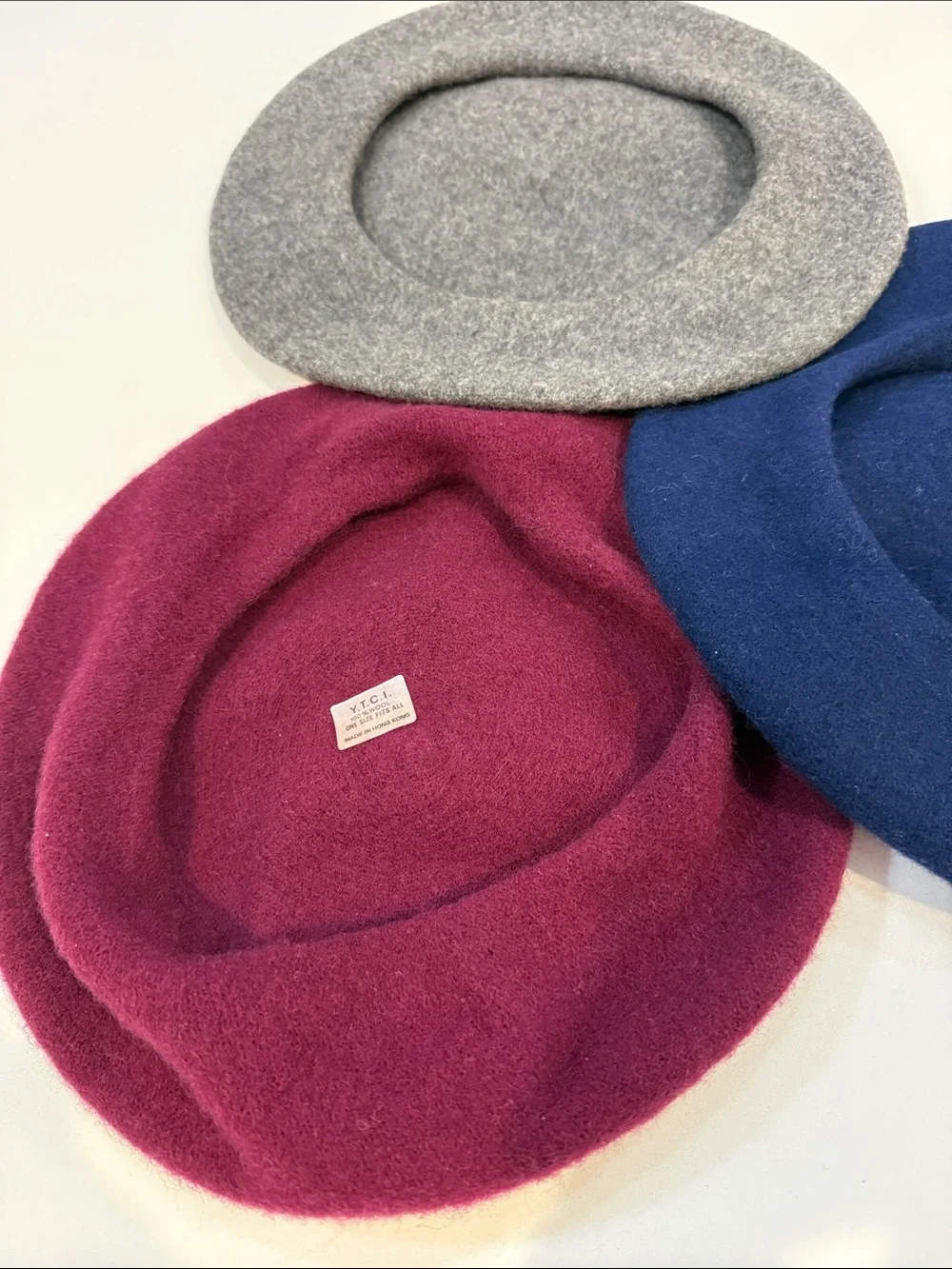 Three Wool Berets in Navy, Burgundy, and Gray